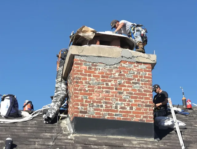 Brunswick Chimney Sweep installing a custom chimney crown in Brunswick, GA