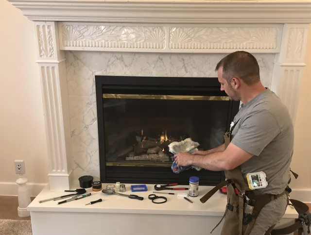 Brunswick Chimney Sweep performing fireplace maintenance in Brunswick, GA