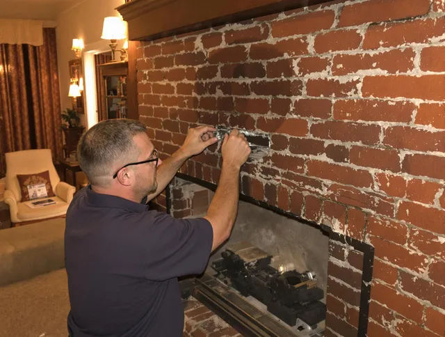 Brunswick Chimney Sweep expert fixing a fireplace in Brunswick, GA